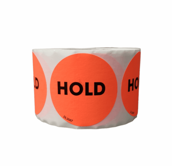 A roll of 2" orange circular labels with "HOLD" in bold black letters on each label.