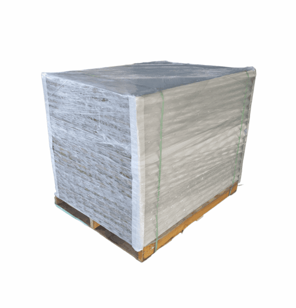 A large pallet stacked with wrapped white sheets or paper.
