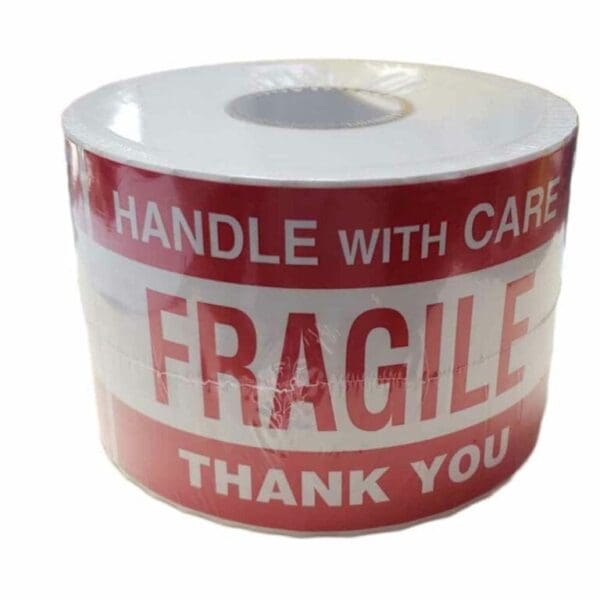 Roll of fragile warning tape with "Handle With Care" text.