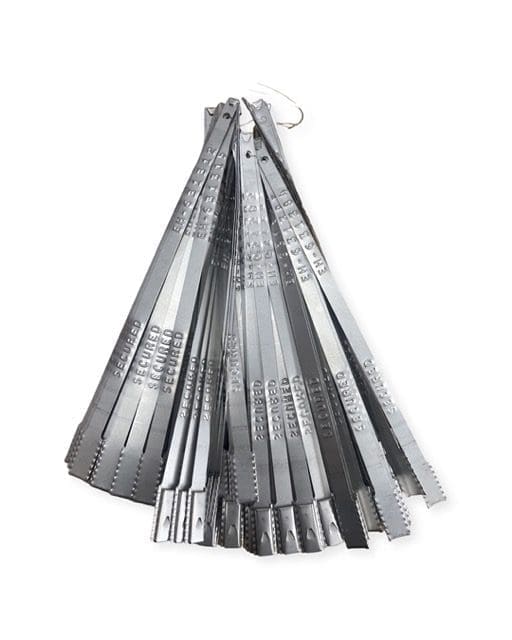 Set of metal feeler gauges with various thickness blades.