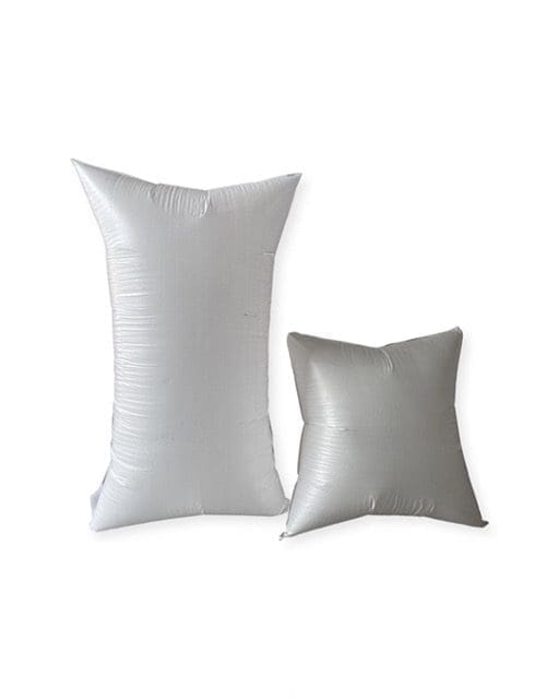 Two white inflatable air pillows of different sizes.