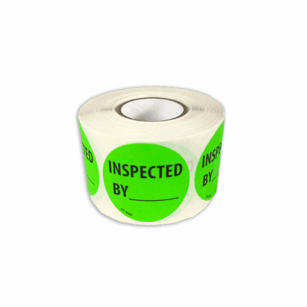 A roll of green inspection stickers with "INSPECTED BY" text.
