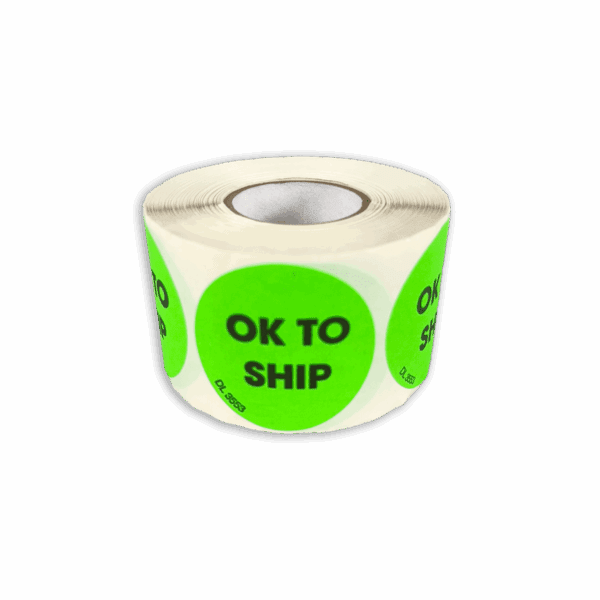 Roll of bright green circular stickers labeled 'OK TO SHIP'.