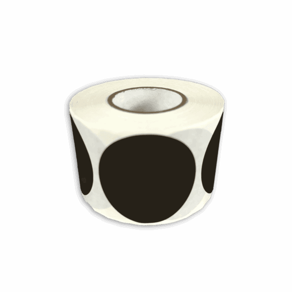 A roll of white stickers with large black dots.